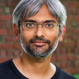 Professional headshot of a man. 